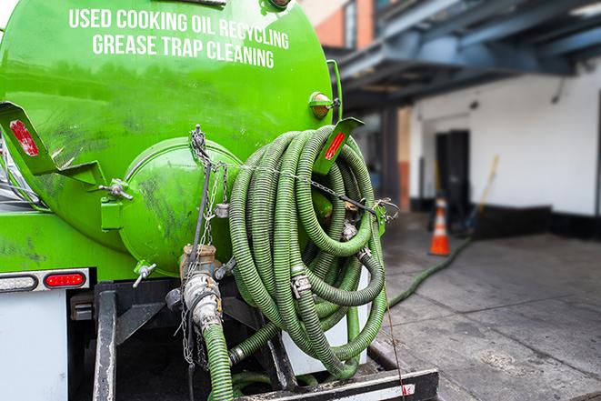 large truck pumping grease trap at a restaurant in Alhambra